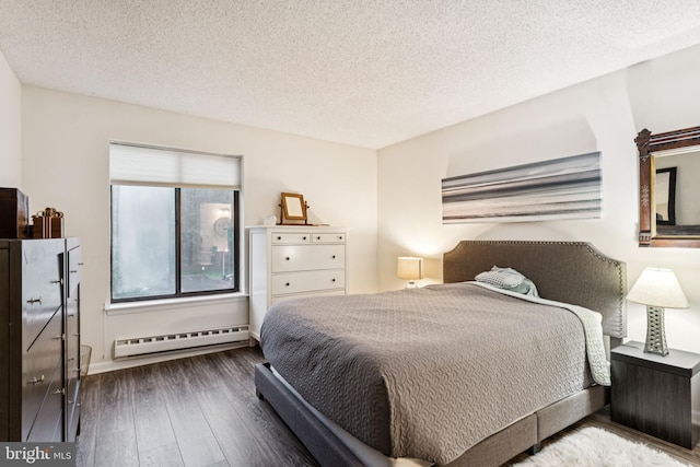 15301 Beaverbrook Ct Unit 92-3K, Silver Spring, MD 20906 - bedroom with baseboard heating, hardwood / wood-style flooring, and a textured ceiling