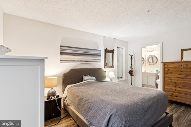 15301 Beaverbrook Ct Unit 92-3K, Silver Spring, MD 20906 - bedroom with wood finished floors, a textured ceiling, and ensuite bathroom