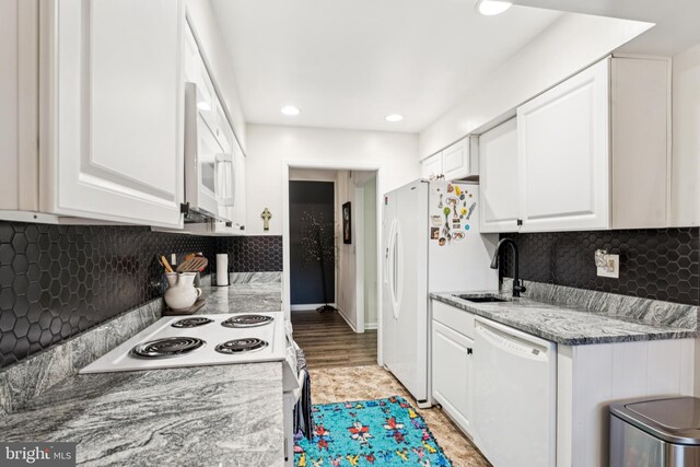 15301 Beaverbrook Ct Unit 92-3K, Silver Spring, MD 20906 - kitchen with white appliances, white cabinetry, recessed lighting, and tasteful backsplash