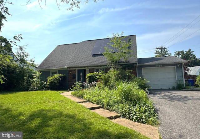 2818 Spiral Ln, Bowie, MD 20715 - cape cod-style house featuring a front lawn, a garage, roof mounted solar panels, asphalt driveway, and brick siding