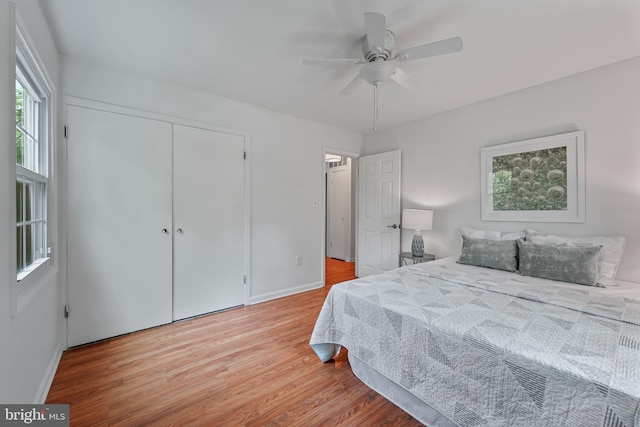 2818 Spiral Ln, Bowie, MD 20715 - bedroom with light wood-style flooring, a closet, and a ceiling fan