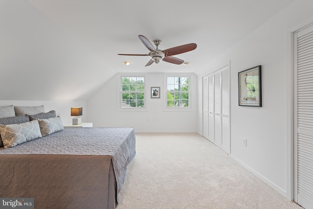 2818 Spiral Ln, Bowie, MD 20715 - bedroom with multiple closets, light colored carpet, vaulted ceiling, and a ceiling fan