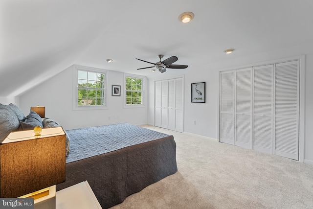 2818 Spiral Ln, Bowie, MD 20715 - carpeted bedroom with two closets, vaulted ceiling, and ceiling fan