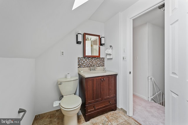 2818 Spiral Ln, Bowie, MD 20715 - bathroom featuring a skylight, vanity, tasteful backsplash, and lofted ceiling