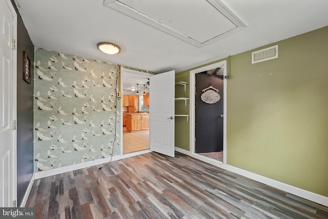 2818 Spiral Ln, Bowie, MD 20715 - unfurnished bedroom featuring attic access, wood finished floors, and ensuite bathroom