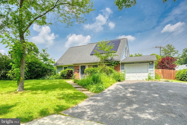 2818 Spiral Ln, Bowie, MD 20715 - cape cod-style house with a garage, asphalt driveway, brick siding, roof with shingles, and solar panels