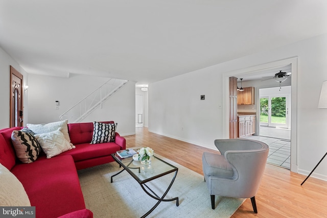 2818 Spiral Ln, Bowie, MD 20715 - living area with light wood-style flooring, stairs, and ceiling fan