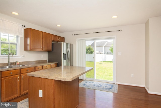 43 Oak Crest Ct, Hanover, PA 17331 - kitchen featuring stainless steel fridge with ice dispenser, dark wood-type flooring, brown cabinetry, recessed lighting, and a kitchen island