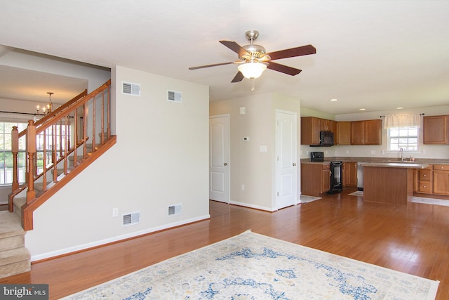 43 Oak Crest Ct, Hanover, PA 17331 - unfurnished living room featuring dark wood-style flooring, a chandelier, stairs, ceiling fan, and recessed lighting