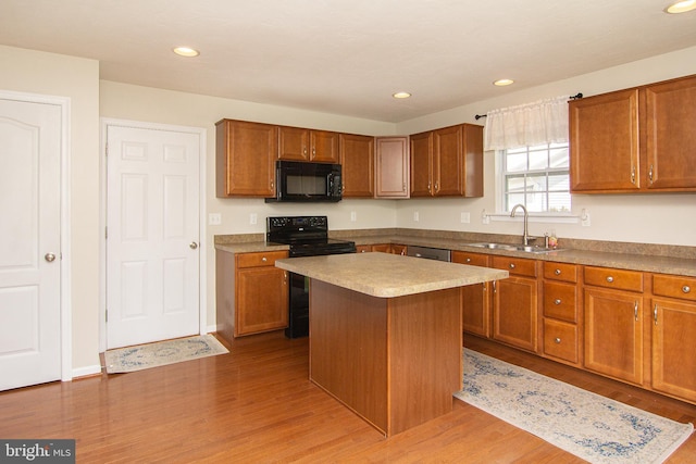 43 Oak Crest Ct, Hanover, PA 17331 - kitchen with black appliances, light wood-type flooring, a center island, brown cabinets, and recessed lighting