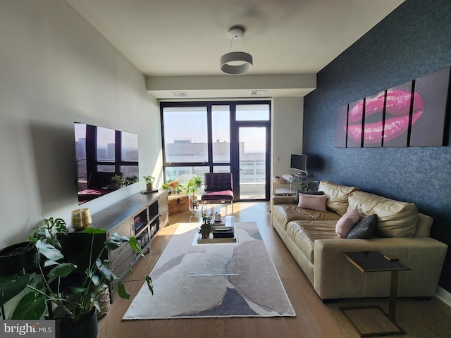 1650 Silver Hill Dr Unit 1608, Mclean, VA 22102 - living room featuring wood finished floors and an accent wall