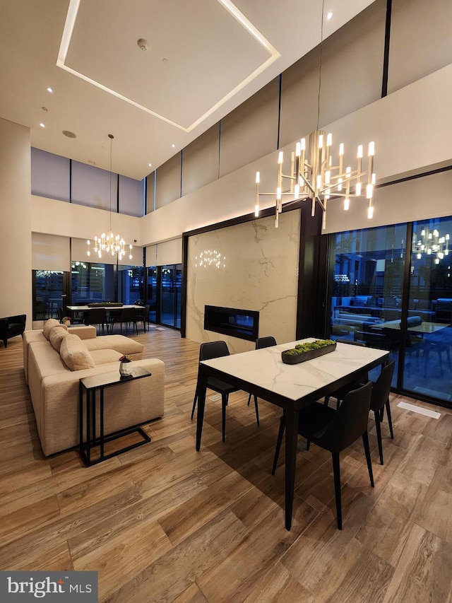 1650 Silver Hill Dr Unit 1608, Mclean, VA 22102 - dining area with a chandelier, a high ceiling, and light wood-style floors