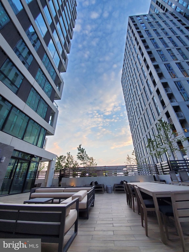 1650 Silver Hill Dr Unit 1608, Mclean, VA 22102 - deck at dusk featuring an outdoor living space