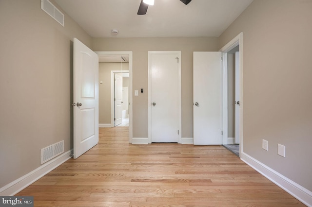 3010 Forrest Ave, Dover, DE 19904 - unfurnished bedroom featuring light wood-style flooring, attic access, and ceiling fan