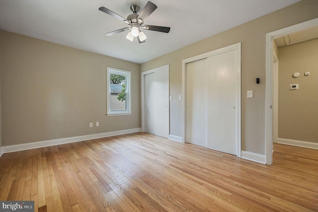 3010 Forrest Ave, Dover, DE 19904 - unfurnished bedroom featuring two closets, light wood-style flooring, attic access, and ceiling fan