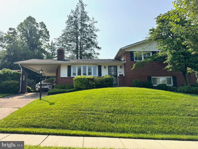 5020 Mccall St, Rockville, MD 20853 - split level home featuring brick siding, a front lawn, a chimney, concrete driveway, and an attached carport