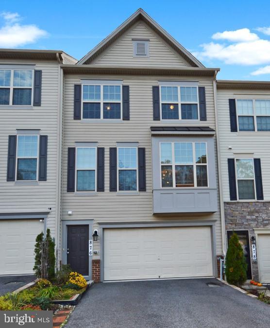 876 Nancy Lynn Ln, Arnold, MD 21012 - view of property with asphalt driveway and a garage