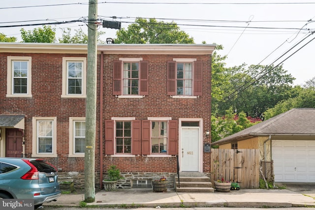6022 Mccallum St, Philadelphia, PA 19144 - view of front of home with brick siding, a garage, and entry steps