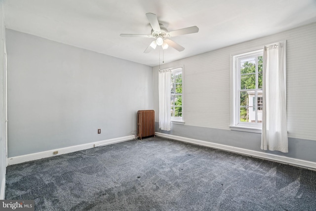 6022 Mccallum St, Philadelphia, PA 19144 - empty room featuring radiator, dark carpet, and a ceiling fan