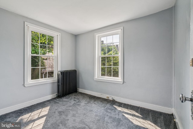 6022 Mccallum St, Philadelphia, PA 19144 - carpeted empty room featuring radiator heating unit and healthy amount of natural light