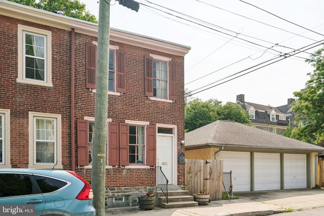 6022 Mccallum St, Philadelphia, PA 19144 - view of front of house with brick siding and a detached garage