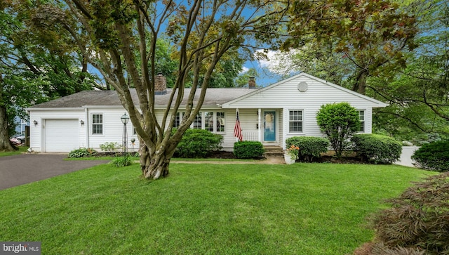 1226 Brownsville Rd, Feasterville Trevose, PA 19053 - single story home featuring a chimney, an attached garage, asphalt driveway, a front lawn, and roof with shingles