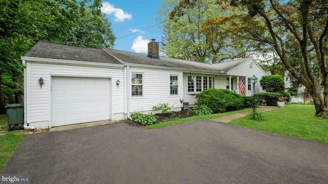 1226 Brownsville Rd, Feasterville Trevose, PA 19053 - ranch-style house featuring an attached garage, a chimney, a front yard, and driveway