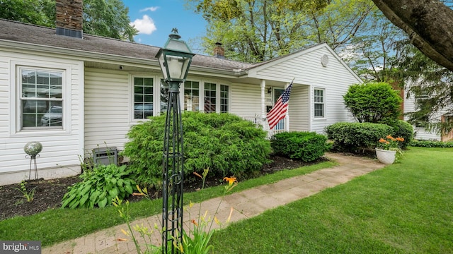 1226 Brownsville Rd, Feasterville Trevose, PA 19053 - view of front of house with a chimney and a front yard
