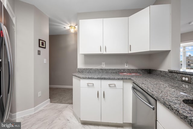 100 Harborview Dr Unit 212, Baltimore, MD 21230 - kitchen featuring stainless steel appliances, white cabinetry, light marble finish floors, and dark stone countertops