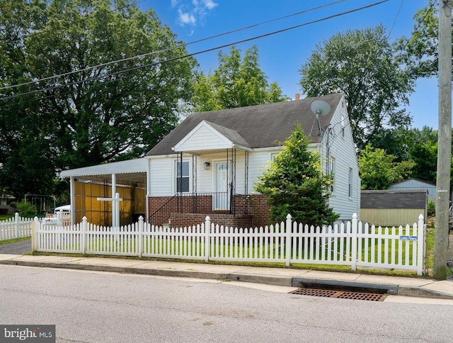 355 Montrose Ave, Baltimore, MD 21221 - bungalow-style home featuring a fenced front yard, brick siding, and a shingled roof