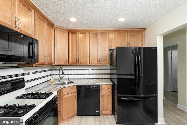 49 Joyner Ct, Lawrence, NJ 08648 - kitchen featuring black appliances, light wood-type flooring, brown cabinets, a textured ceiling, and recessed lighting