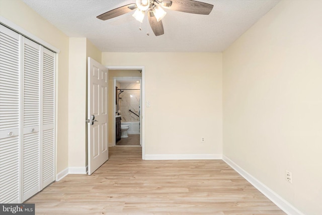 49 Joyner Ct, Lawrence, NJ 08648 - unfurnished bedroom with a closet, light wood-style floors, ceiling fan, and a textured ceiling