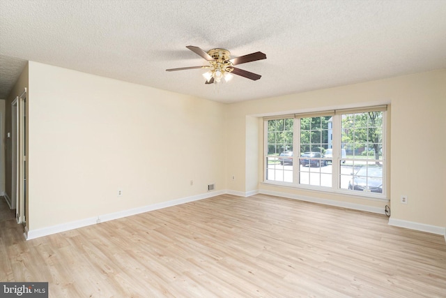 49 Joyner Ct, Lawrence, NJ 08648 - unfurnished room featuring ceiling fan, light wood-style floors, and a textured ceiling