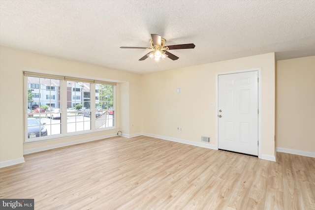 49 Joyner Ct, Lawrence, NJ 08648 - empty room with light wood-style floors, a ceiling fan, and a textured ceiling