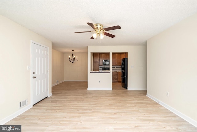 49 Joyner Ct, Lawrence, NJ 08648 - unfurnished living room featuring a chandelier, ceiling fan, and light wood-type flooring