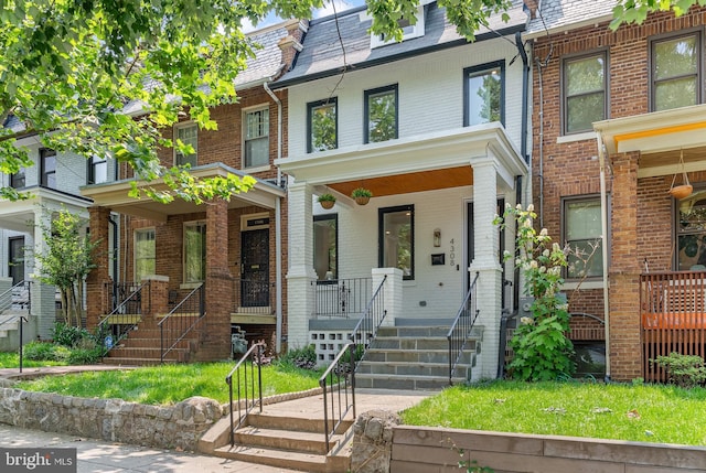 4308 4th St NW, Washington, DC 20011 - view of property featuring covered porch and brick siding