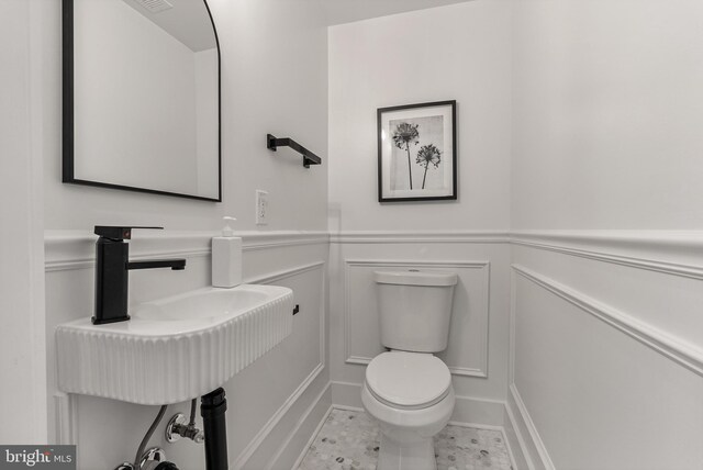 4308 4th St NW, Washington, DC 20011 - bathroom featuring a decorative wall and wainscoting