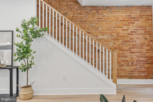 4308 4th St NW, Washington, DC 20011 - staircase with brick wall and wood finished floors