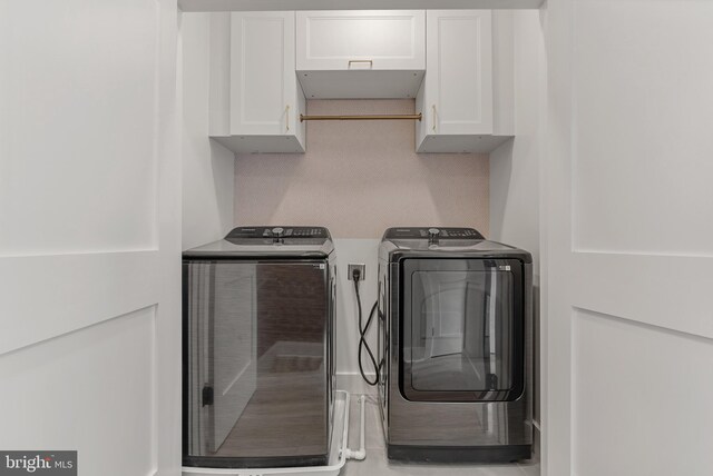 4308 4th St NW, Washington, DC 20011 - washroom featuring cabinet space and washing machine and clothes dryer