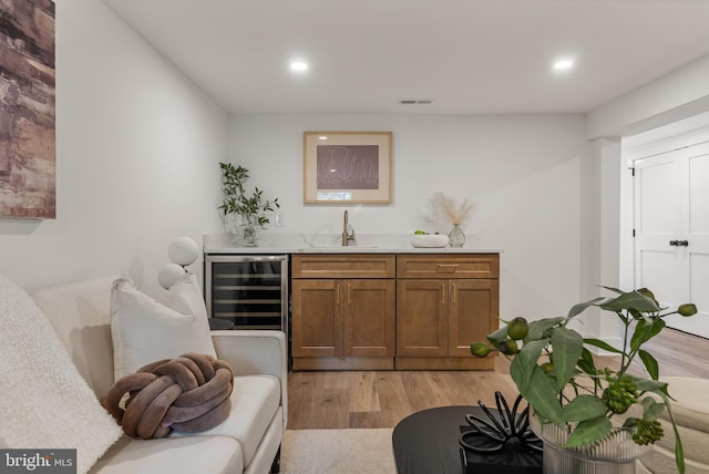 4308 4th St NW, Washington, DC 20011 - indoor wet bar featuring wine cooler, light wood finished floors, and recessed lighting
