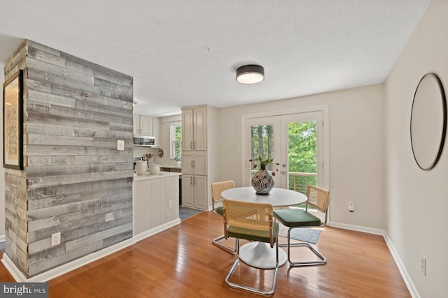 7012 Vantage Dr, Alexandria, VA 22306 - dining space with light wood-style flooring and french doors