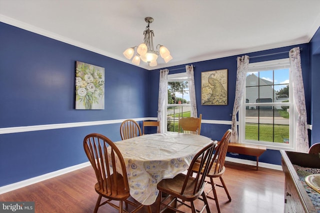 2785 Sparrow Dr, York, PA 17408 - dining area with a chandelier, wood finished floors, and crown molding