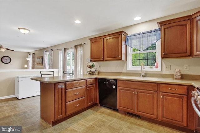 2785 Sparrow Dr, York, PA 17408 - kitchen featuring black dishwasher, a peninsula, healthy amount of natural light, light countertops, and recessed lighting