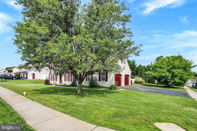 2785 Sparrow Dr, York, PA 17408 - obstructed view of property with asphalt driveway, a garage, and a front lawn