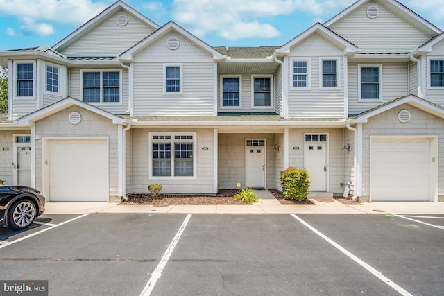 19967 Sandy Bottom Cir Unit 103, Rehoboth Beach, DE 19971 - townhome / multi-family property featuring a shingled roof and an attached garage