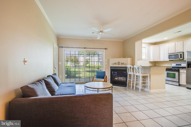 19967 Sandy Bottom Cir Unit 103, Rehoboth Beach, DE 19971 - living area with light tile patterned flooring, a glass covered fireplace, ornamental molding, and ceiling fan