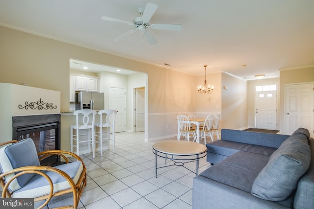 19967 Sandy Bottom Cir Unit 103, Rehoboth Beach, DE 19971 - living room with a multi sided fireplace, ornamental molding, a chandelier, light tile patterned floors, and ceiling fan