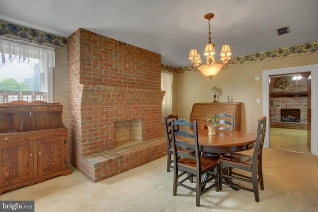 8029 Molly Pitcher Hwy, Shippensburg, PA 17257 - dining room with a brick fireplace, light colored carpet, and a chandelier