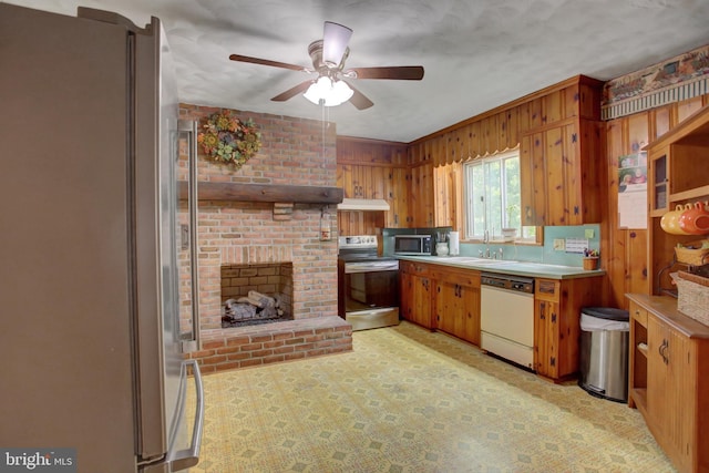 8029 Molly Pitcher Hwy, Shippensburg, PA 17257 - kitchen with appliances with stainless steel finishes, under cabinet range hood, ceiling fan, light countertops, and brown cabinetry