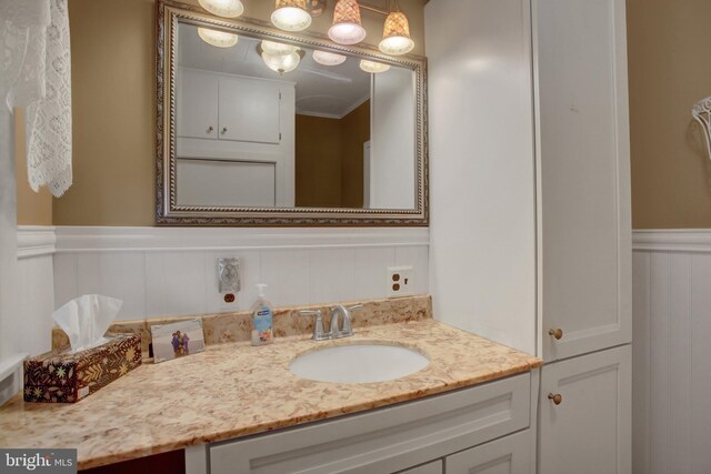 8029 Molly Pitcher Hwy, Shippensburg, PA 17257 - bathroom with vanity, wainscoting, ornamental molding, and a decorative wall